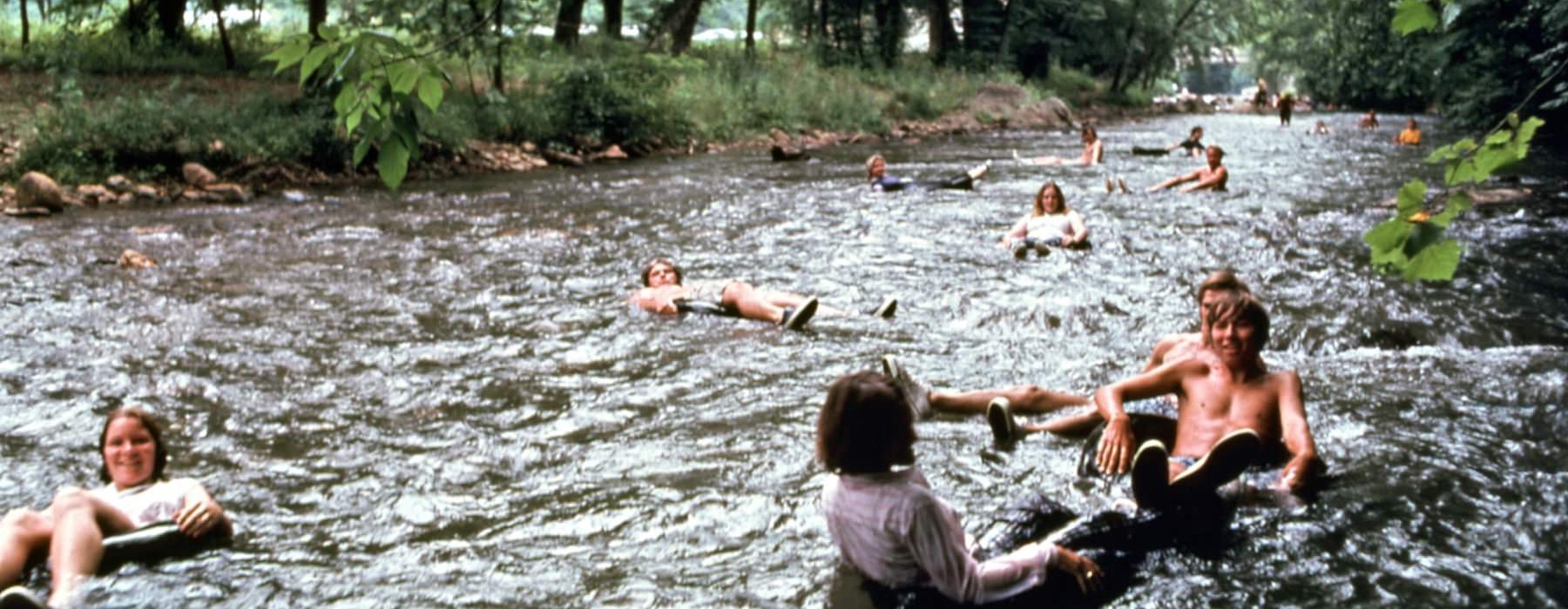 a group of people in a river